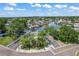 Aerial view of a waterfront community featuring lush landscaping, boat docks, and beautiful canal views at 4918 Stolls Ave, Tampa, FL 33615