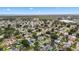 Wide aerial view of a residential neighborhood near the ocean, showcasing a variety of homes at 4918 Stolls Ave, Tampa, FL 33615