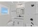 This bathroom features modern vanity, framed mirror and updated shower with beautiful tile at 4918 Stolls Ave, Tampa, FL 33615
