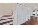 Interior hallway featuring stairs, a closet, and wood floors at 4918 Stolls Ave, Tampa, FL 33615
