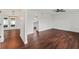 Open living space with sleek hardwood flooring and bright, neutral walls at 4918 Stolls Ave, Tampa, FL 33615