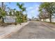 Community boat ramp street view featuring a sign at the entrance, and palm trees at 4918 Stolls Ave, Tampa, FL 33615