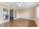 Bright and spacious living room featuring beautiful french doors and hardwood floors at 5377 Springwood Blvd, Pinellas Park, FL 33782