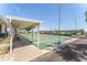 Outdoor recreation area features covered shuffleboard courts with shade, benches, and well-maintained green space for leisure activities at 5377 Springwood Blvd, Pinellas Park, FL 33782