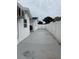 Side of house with long driveway to the backyard and new fence at 539 Freeport N Ave, St Petersburg, FL 33702