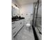 A stylish bathroom featuring a glass shower, modern vanity, and sleek fixtures at 539 Freeport N Ave, St Petersburg, FL 33702