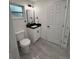 Bright bathroom featuring a new sink, toilet and matte black hardware at 539 Freeport N Ave, St Petersburg, FL 33702