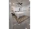 Bedroom features a modern ceiling fan, white bedding, and stylish rug at 539 Freeport N Ave, St Petersburg, FL 33702