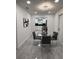 Cozy dining room with a glass-top table, four chairs, and modern lighting at 539 Freeport N Ave, St Petersburg, FL 33702