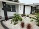 Close-up of well maintained home with nicely landscaped front yard at 539 Freeport N Ave, St Petersburg, FL 33702