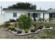 Charming home featuring a well-manicured front yard with lovely landscaping at 539 Freeport N Ave, St Petersburg, FL 33702