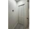 Image shows the white bi-fold closet doors of the entry way coat closet at 539 Freeport N Ave, St Petersburg, FL 33702