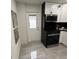 Kitchen featuring new, stainless steel appliances, white cabinets, and granite countertops at 539 Freeport N Ave, St Petersburg, FL 33702