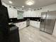 Modern kitchen featuring sleek appliances, granite countertops, and ample cabinet space at 539 Freeport N Ave, St Petersburg, FL 33702