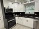 Stylish kitchen featuring modern appliances, granite countertops, and custom cabinetry at 539 Freeport N Ave, St Petersburg, FL 33702