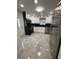 Modern kitchen featuring stainless steel appliances, granite countertops, and white cabinets at 539 Freeport N Ave, St Petersburg, FL 33702