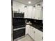 Kitchen featuring new, stainless steel appliances, white cabinets, and granite countertops at 539 Freeport N Ave, St Petersburg, FL 33702