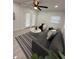 Bright living room with ceiling fan, mini split AC and modern decor at 539 Freeport N Ave, St Petersburg, FL 33702