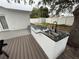Outdoor kitchen area with a sink and stone countertop, ideal for outdoor dining and entertaining at 539 Freeport N Ave, St Petersburg, FL 33702