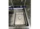 Modern kitchen sink featuring a sleek faucet with purified water pouring into the basin at 539 Freeport N Ave, St Petersburg, FL 33702