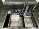Close up of a kitchen sink with stainless steel faucet and granite countertops at 539 Freeport N Ave, St Petersburg, FL 33702