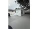 Exterior view of a studio featuring painted floors, a window, and glass doors at 539 Freeport N Ave, St Petersburg, FL 33702