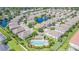 Enjoy the community pool from an aerial view showcasing the lush landscaping and common areas at 589 52Nd N Ave, St Petersburg, FL 33703