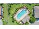 Aerial view of an amazing community pool with lush greenery and a relaxing lounge area at 589 52Nd N Ave, St Petersburg, FL 33703