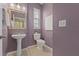 Powder room with a pedestal sink, tiled floor, and lavender colored walls at 589 52Nd N Ave, St Petersburg, FL 33703