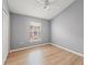 Clean bedroom with wood-look flooring, ceiling fan and plenty of natural light at 589 52Nd N Ave, St Petersburg, FL 33703