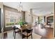 Bright dining room with wood floors that flows into the living room and the front door at 589 52Nd N Ave, St Petersburg, FL 33703