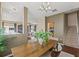 Open-concept dining room with wood floors and views into the kitchen, living room, and staircase at 589 52Nd N Ave, St Petersburg, FL 33703