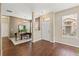 Inviting foyer featuring wood-look floors, neutral walls, a dining area, and natural light at 589 52Nd N Ave, St Petersburg, FL 33703