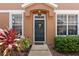 Charming front door entrance flanked by two windows and decorative landscaping on either side at 589 52Nd N Ave, St Petersburg, FL 33703
