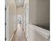 Bright hallway with wood flooring, neutral walls, and white trim throughout the home at 589 52Nd N Ave, St Petersburg, FL 33703