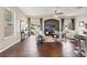 Bright living room with dark wood floors, neutral walls, recessed niche and sliding glass door at 589 52Nd N Ave, St Petersburg, FL 33703
