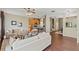 Open-concept living room flowing into the kitchen, featuring modern furnishings and wood-look floors at 589 52Nd N Ave, St Petersburg, FL 33703