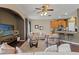 Open-concept living room flowing into the kitchen, featuring modern furnishings and wood-look floors at 589 52Nd N Ave, St Petersburg, FL 33703