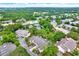 Charming community aerial view with lush trees, waterways, pool, and well-maintained townhomes; a tranquil setting at 6361 92Nd N Pl # 1704, Pinellas Park, FL 33782
