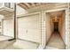 Exterior of a townhouse featuring a garage, front door entrance, and the unit number 1704 at 6361 92Nd N Pl # 1704, Pinellas Park, FL 33782
