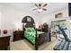 Bedroom featuring dark furniture and decor, ceiling fan, and sliding door access to the pool at 6621 Appaloosa Dr, Tampa, FL 33625