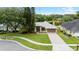 Charming single-story home with a well-maintained lawn, lush landscaping, and a two-car garage with water view at 6621 Appaloosa Dr, Tampa, FL 33625