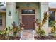 Attractive double front doors are flanked by lush, colorful landscaping at 6621 Appaloosa Dr, Tampa, FL 33625
