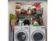 Laundry closet with full size washer and dryer and lots of storage space at 6621 Appaloosa Dr, Tampa, FL 33625