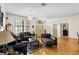 Elegant living room boasts hardwood floors, chandelier, and stylish furnishings at 6621 Appaloosa Dr, Tampa, FL 33625