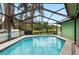 Enjoy this screened pool and beautiful backyard lake view at 6621 Appaloosa Dr, Tampa, FL 33625