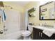 Clean bathroom features a shower-tub combo, and vanity at 6630 Spring Flower Dr # 14, New Port Richey, FL 34653
