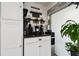 Charming coffee bar nook features a cabinet and granite countertop adjacent to a window at 6630 Spring Flower Dr # 14, New Port Richey, FL 34653