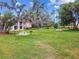 Lush community picnic space with mature trees draped with Spanish moss and BBQ at 6630 Spring Flower Dr # 14, New Port Richey, FL 34653