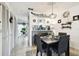 Dining area with a clear view into the kitchen and breakfast nook at 6630 Spring Flower Dr # 14, New Port Richey, FL 34653